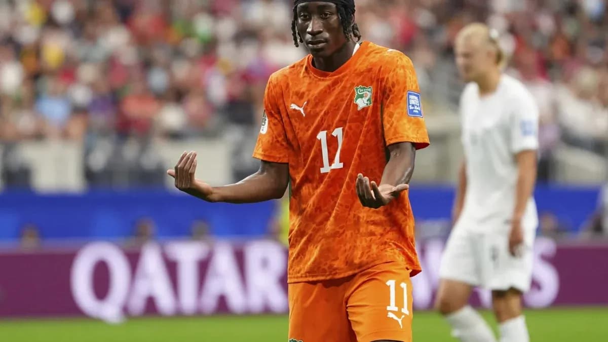 Player gesturing during match in orange jersey Player gesturing during match in orange jersey