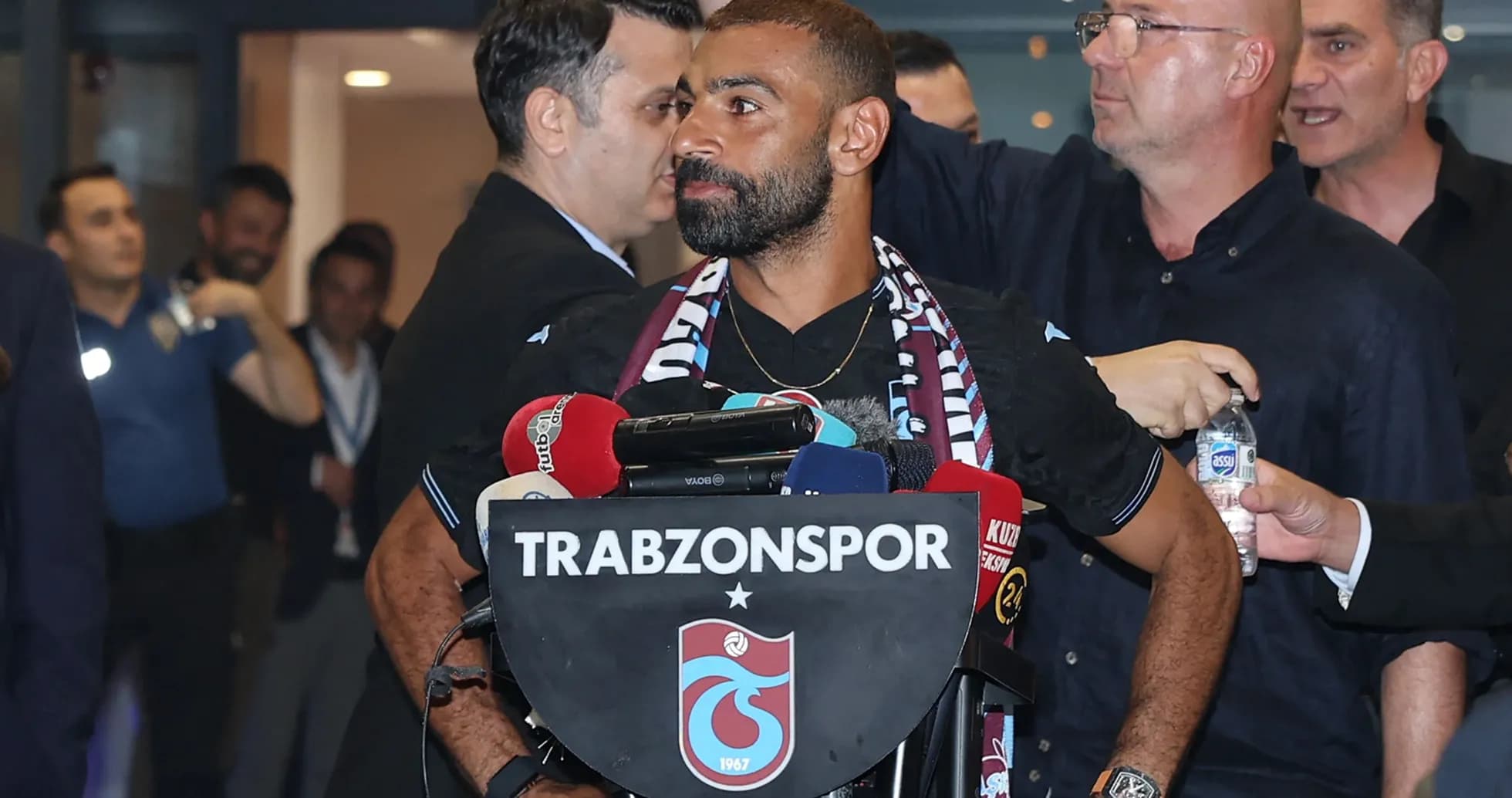Player at press conference with Trabzonspor branding Player at press conference with Trabzonspor branding