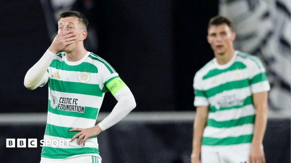 Celtic players reacting during match, one covering face Celtic players reacting during match, one covering face