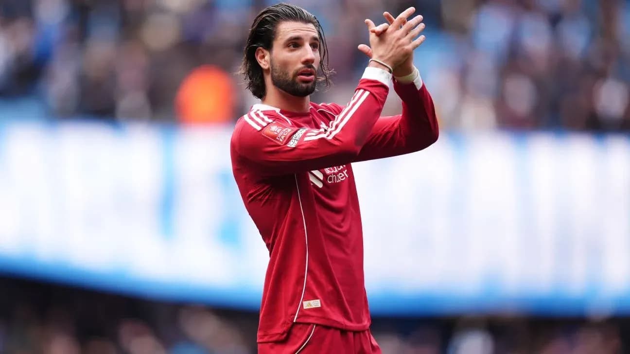 Player applauding fans during match in red jersey Player applauding fans during match in red jersey