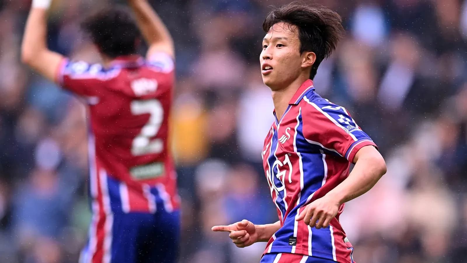 Player celebrating a goal during a match Player celebrating a goal during a match