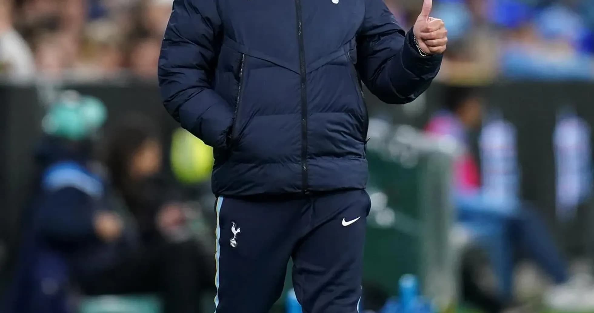 Coach walking along the sideline giving thumbs up Coach walking along the sideline giving thumbs up