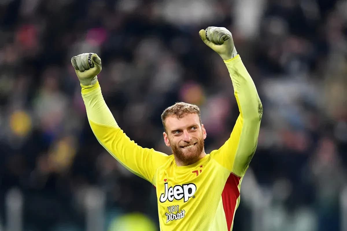 Goalkeeper celebrating victory with raised arms Goalkeeper celebrating victory with raised arms