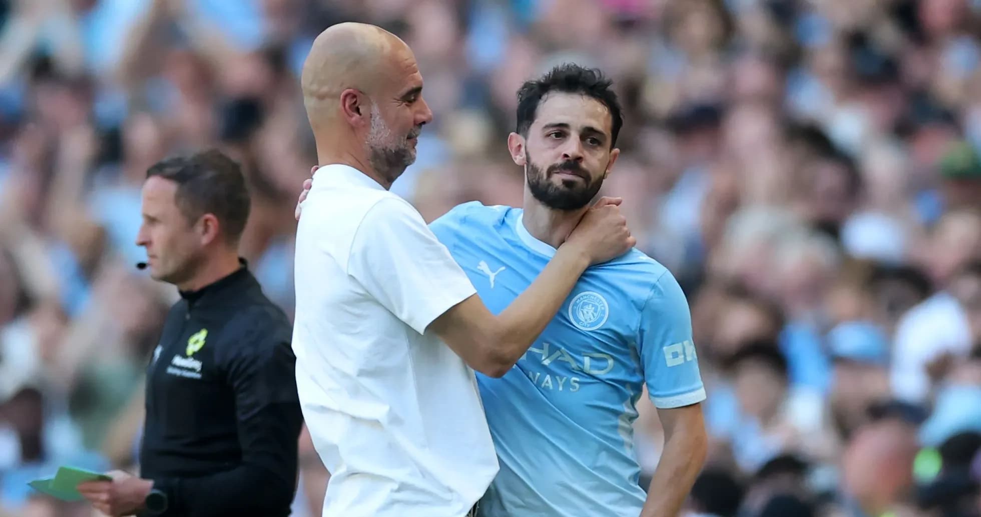 Manager and player embracing during match substitution Manager and player embracing during match substitution