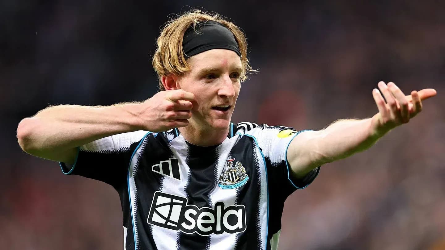 Newcastle player celebrating a goal on the pitch Newcastle player celebrating a goal on the pitch