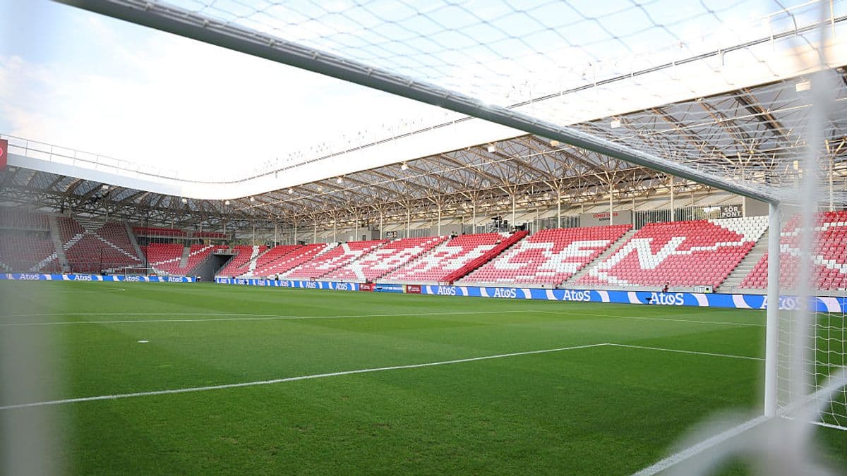 View of a football stadium from behind the goal View of a football stadium from behind the goal