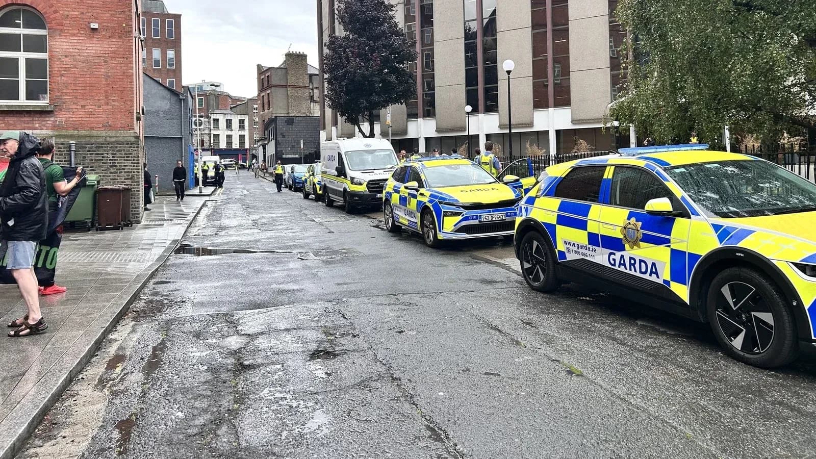 Garda vehicles lined up on a city street Garda vehicles lined up on a city street
