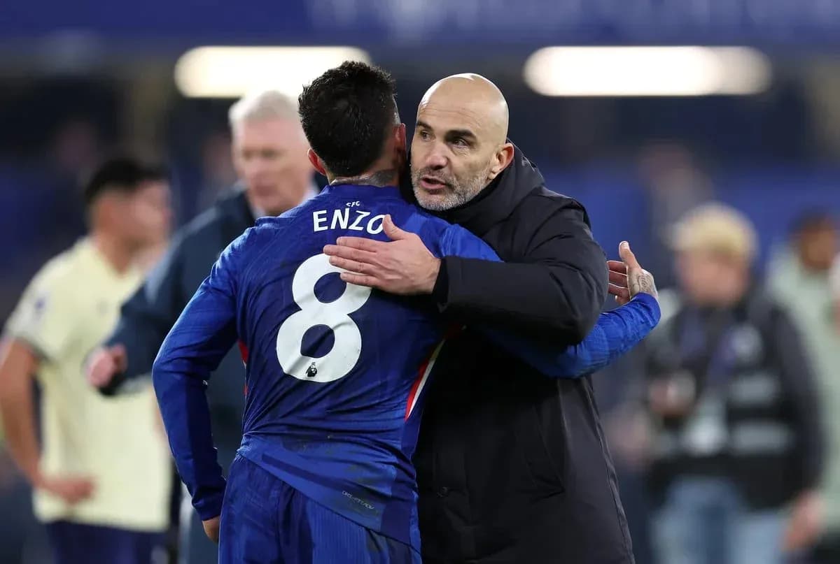 Coach embracing player Enzo after match Coach embracing player Enzo after match