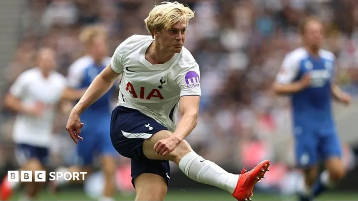 Tottenham player kicking ball during match Tottenham player kicking ball during match