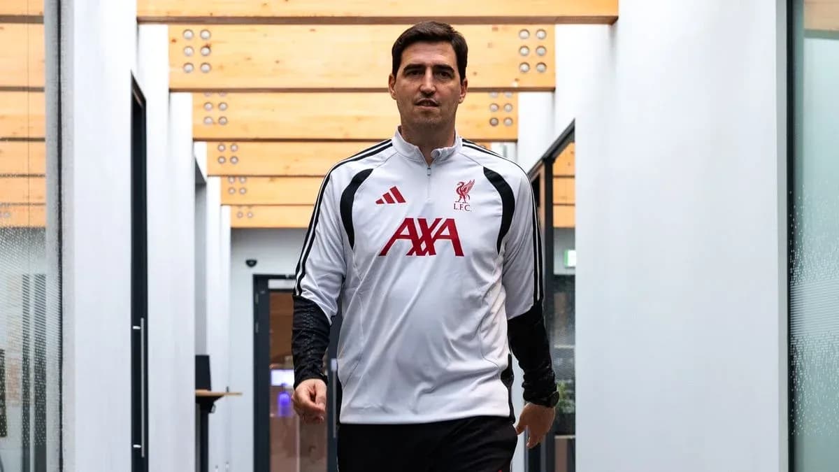 Liverpool FC staff member walking in corridor Liverpool FC staff member walking in corridor