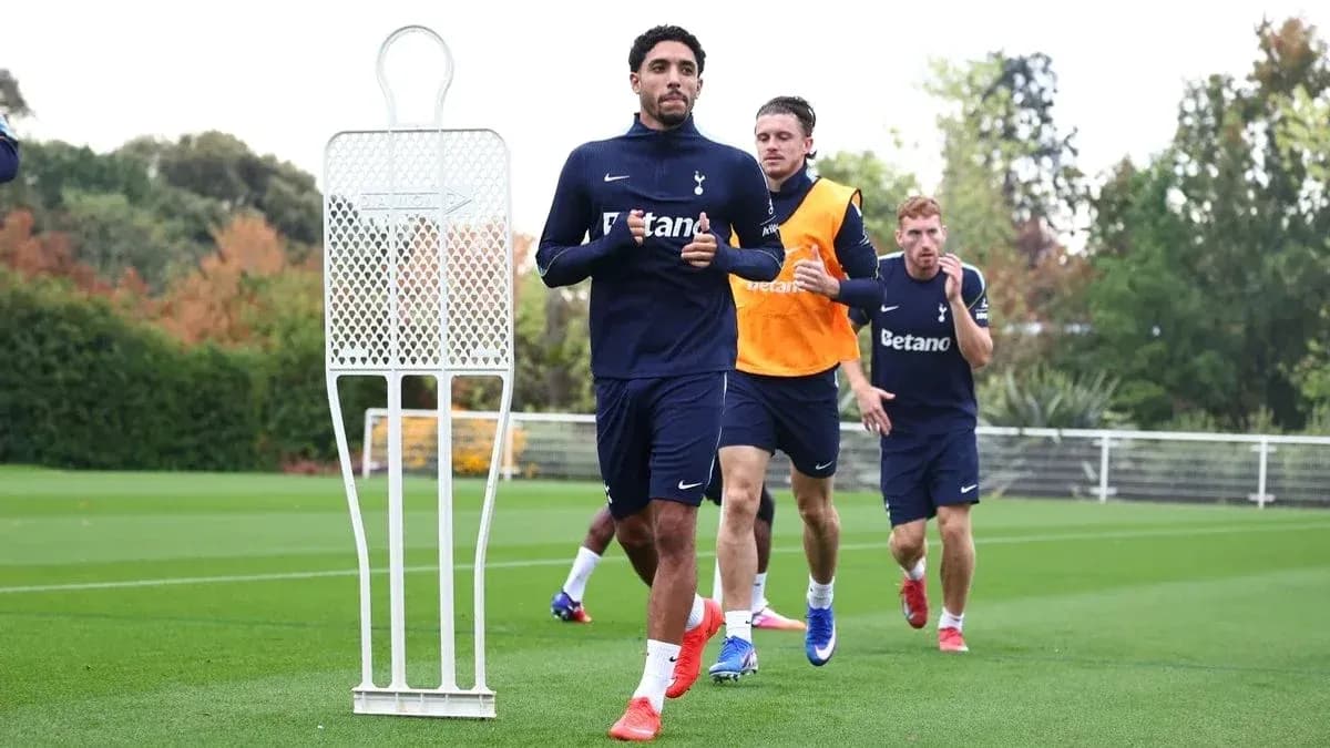 Tottenham players training on the pitch during session Tottenham players training on the pitch during session