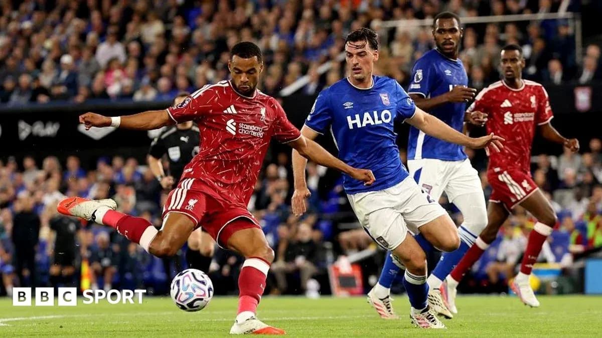 Liverpool player kicking ball against Ipswich Town Liverpool player kicking ball against Ipswich Town