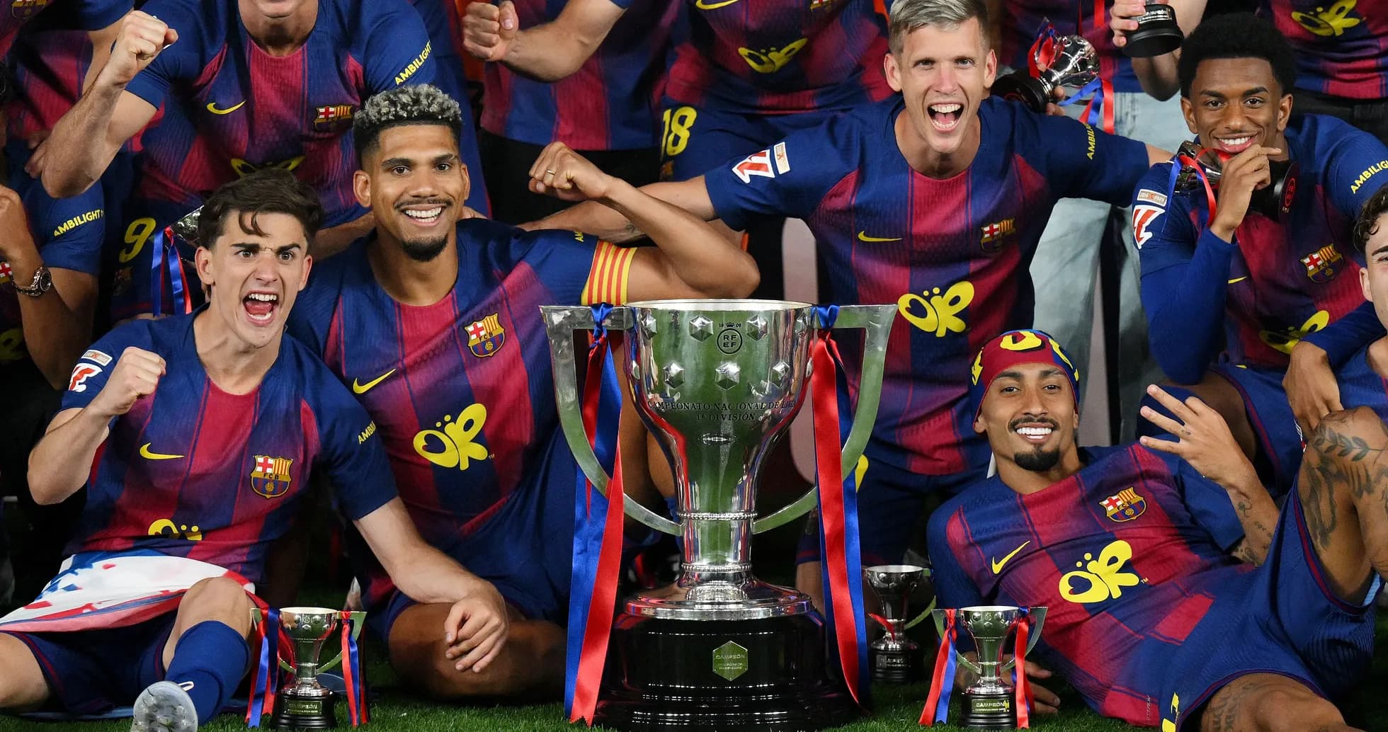 FC Barcelona players celebrating with trophies FC Barcelona players celebrating with trophies