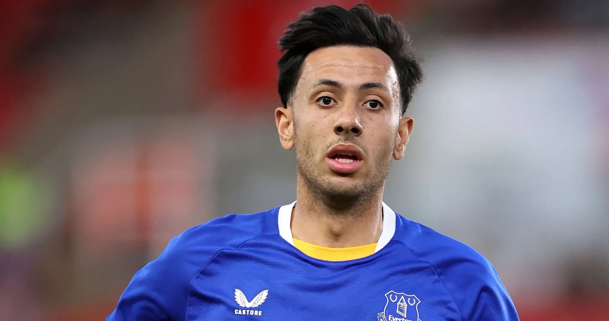 Player wearing Everton jersey on the pitch Player wearing Everton jersey on the pitch
