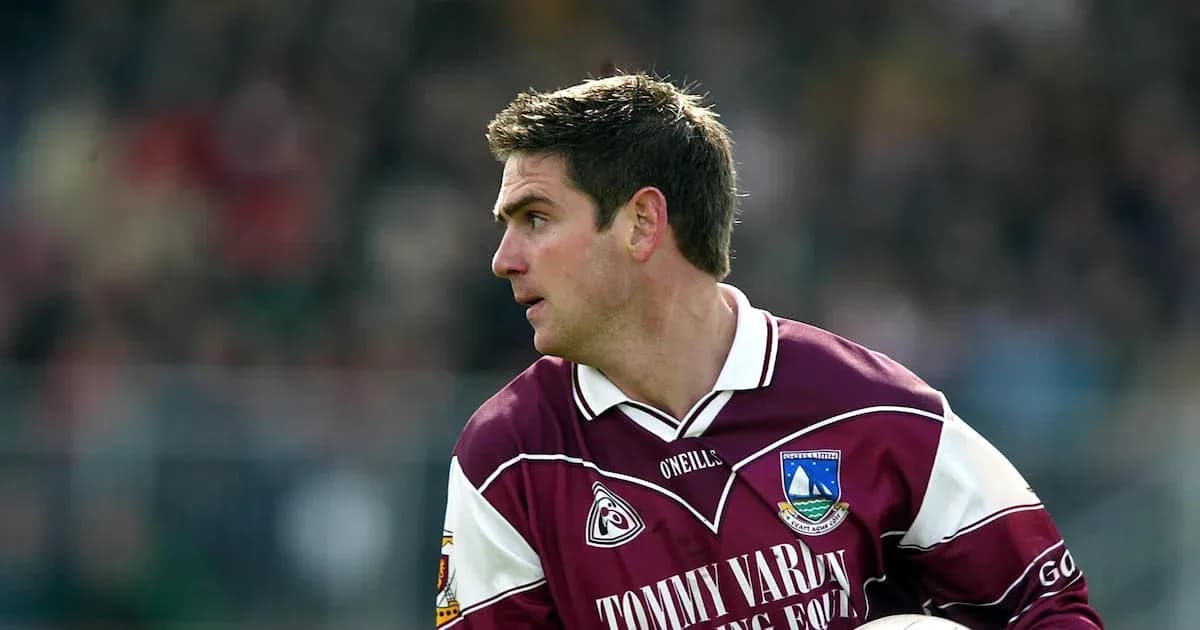 Player in maroon jersey during a match Player in maroon jersey during a match