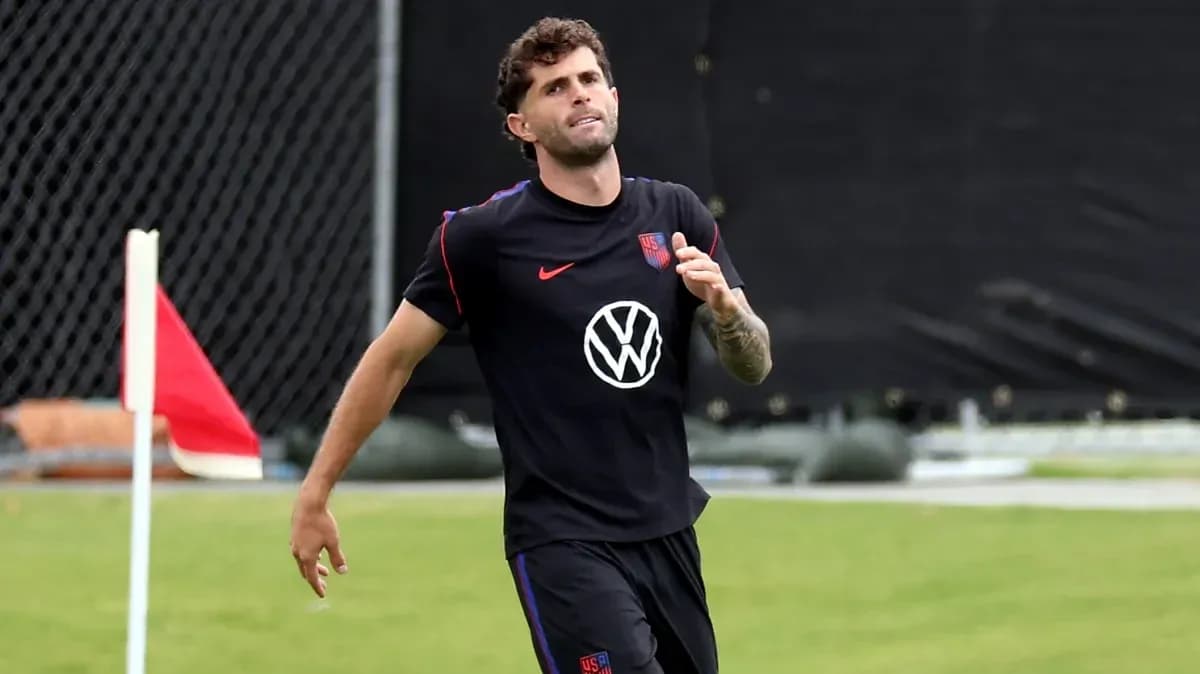 Player jogging on training pitch with corner flag Player jogging on training pitch with corner flag