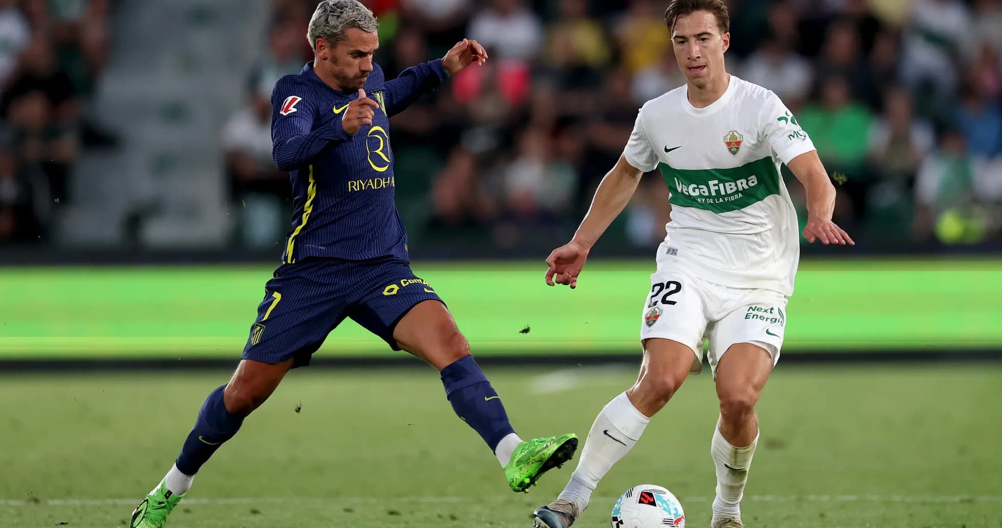 Player challenges for the ball during Elche match Player challenges for the ball during Elche match