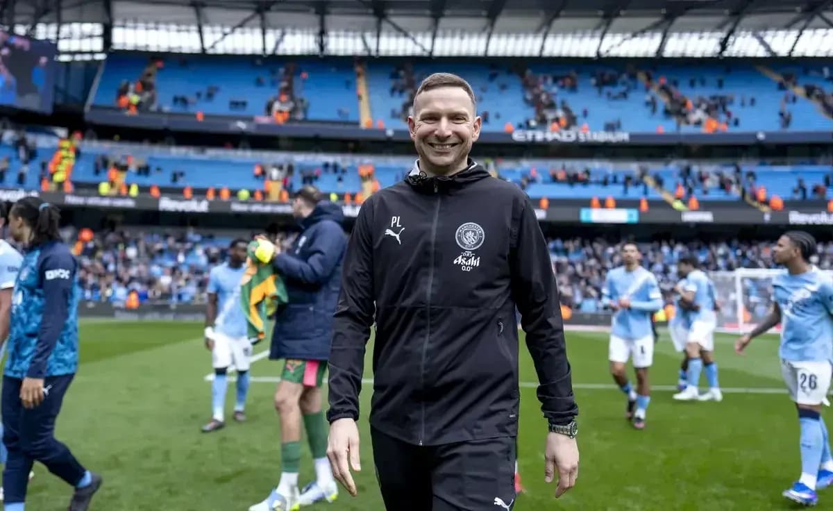 Coach smiling as players leave the pitch Coach smiling as players leave the pitch