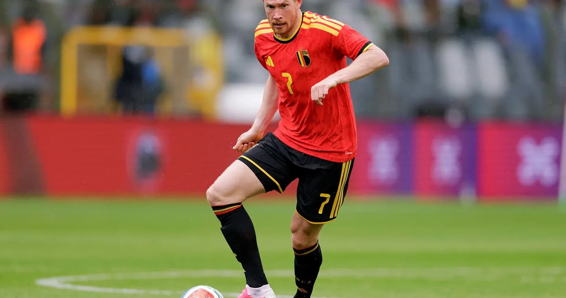 Belgium player dribbling during football match Belgium player dribbling during football match