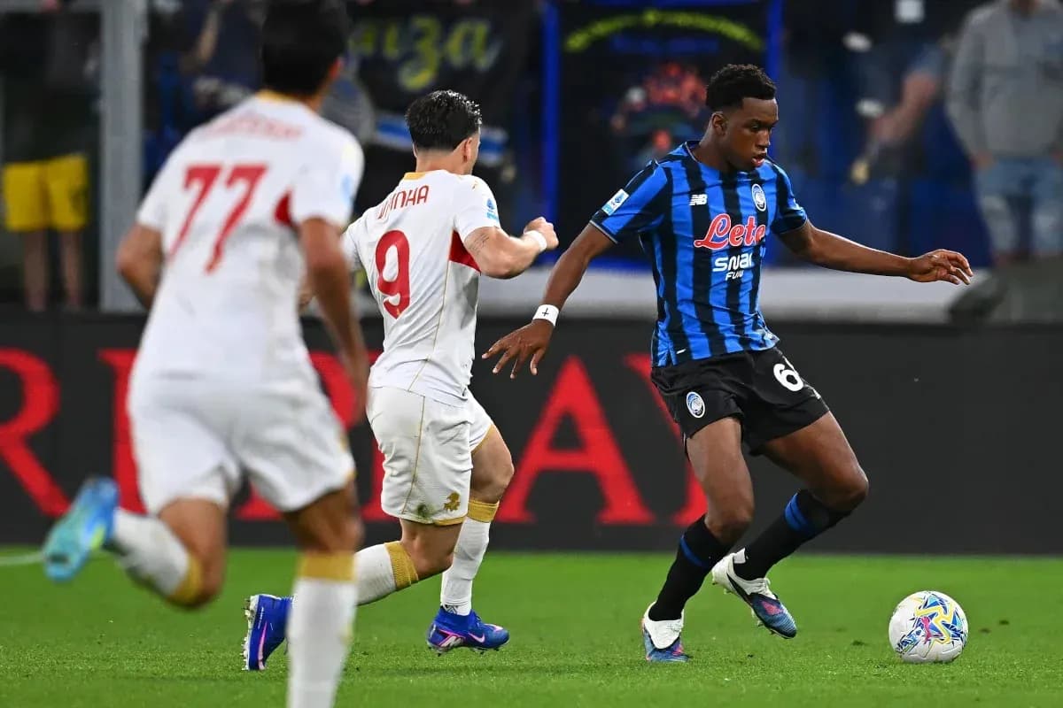 Player dribbling the ball during a match Player dribbling the ball during a match