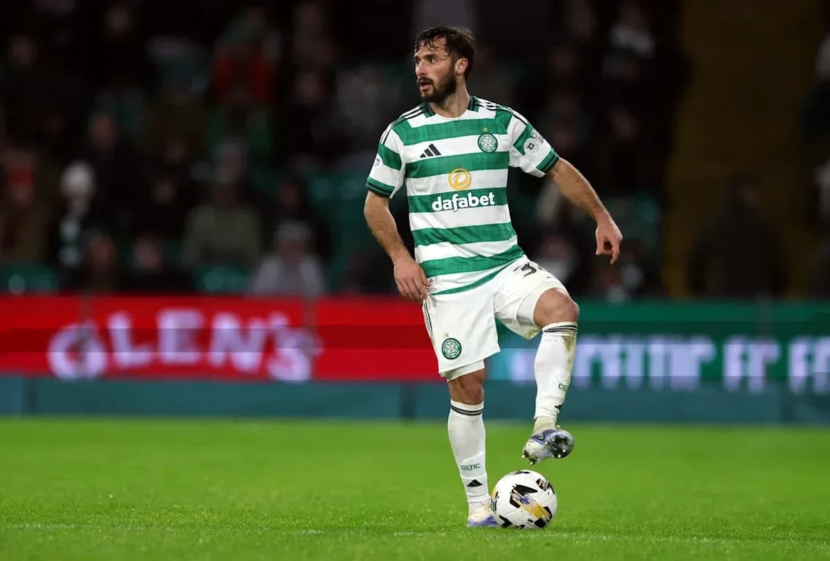 Celtic player controlling ball on pitch Celtic player controlling ball on pitch