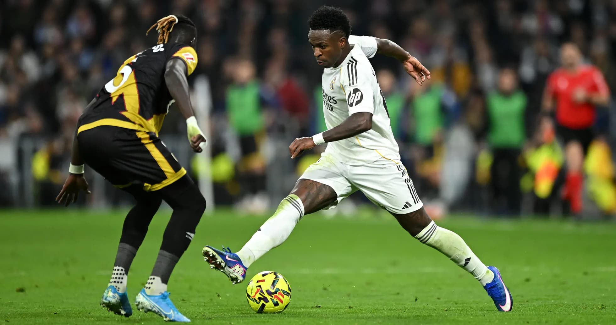 Vinicius Jr. dribbling past defender during match Vinicius Jr. dribbling past defender during match