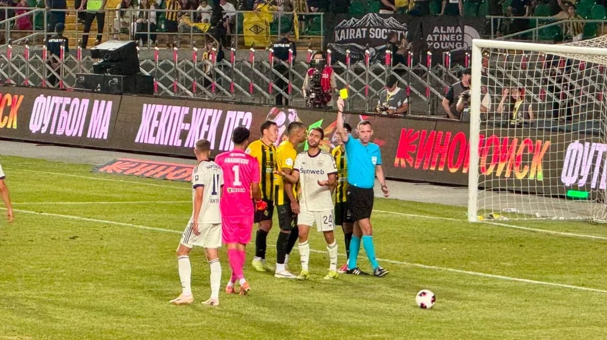 Referee showing yellow card during match Referee showing yellow card during match