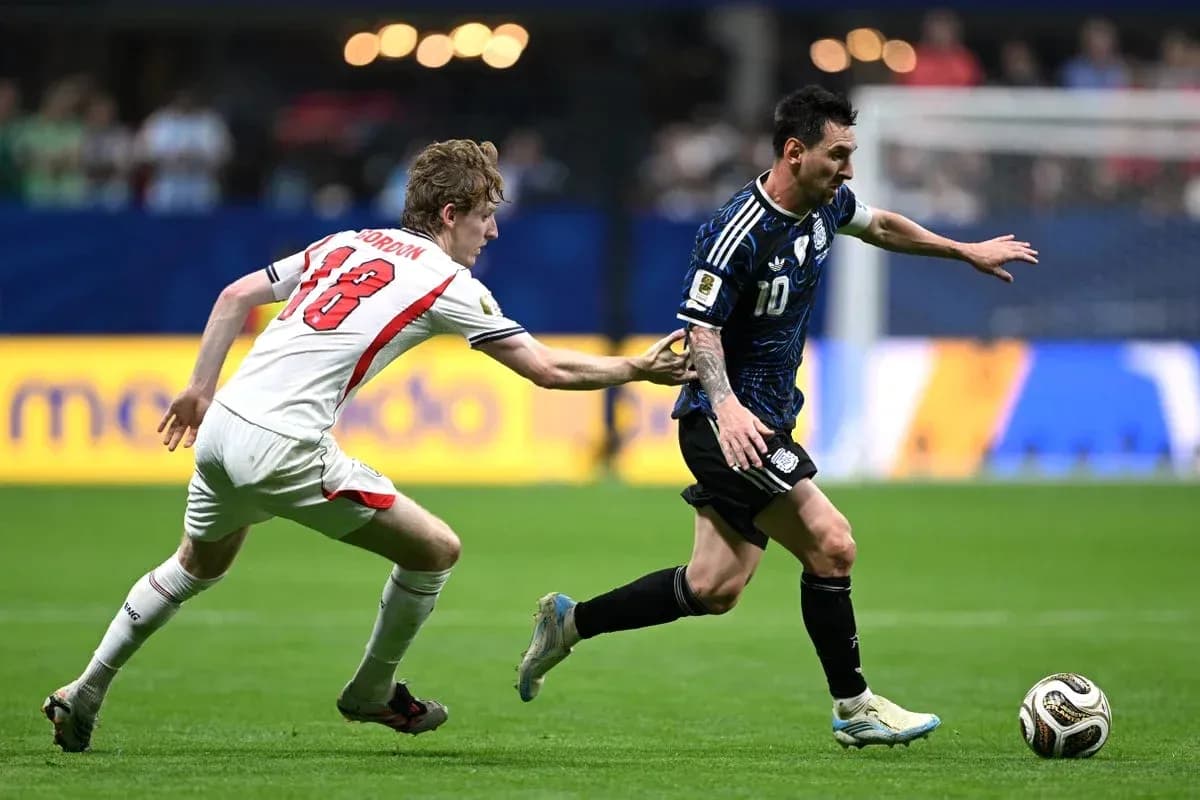 Player wearing blue jersey evading opponent in match Player wearing blue jersey evading opponent in match