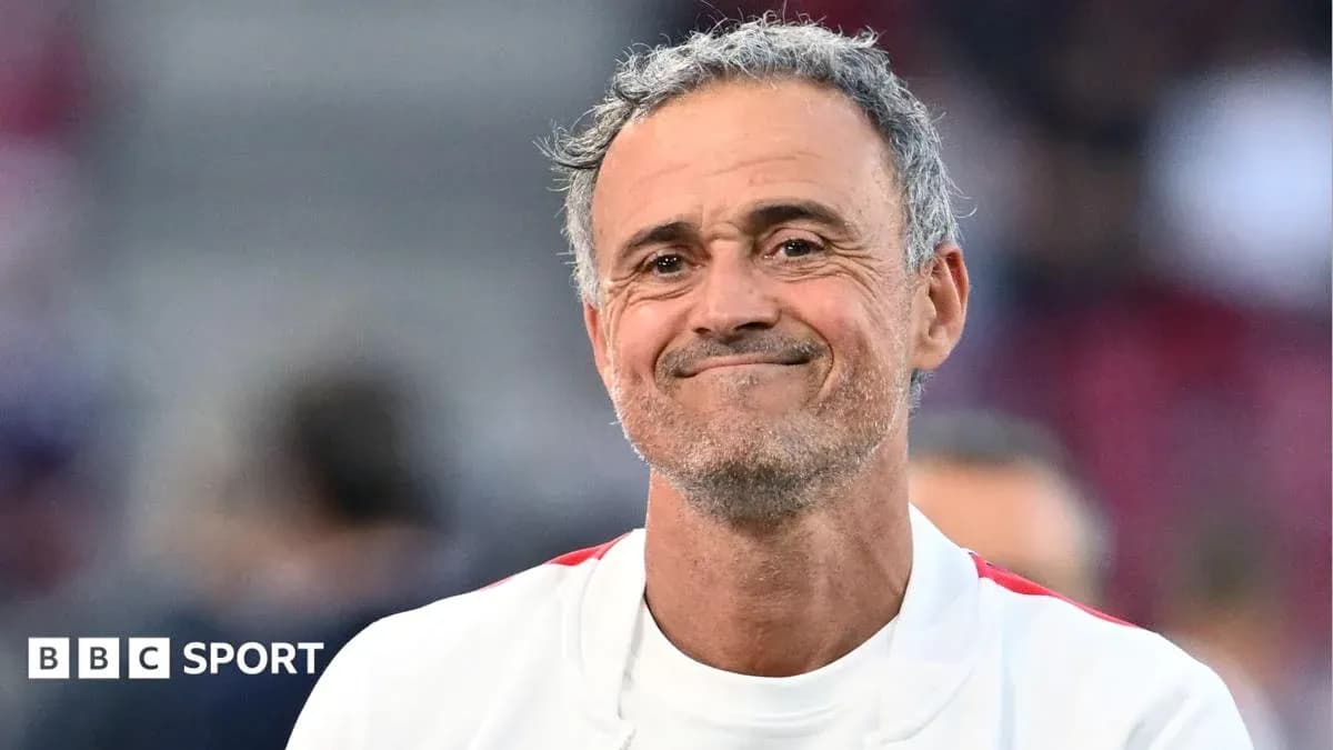 Coach smiling during a match at the stadium Coach smiling during a match at the stadium