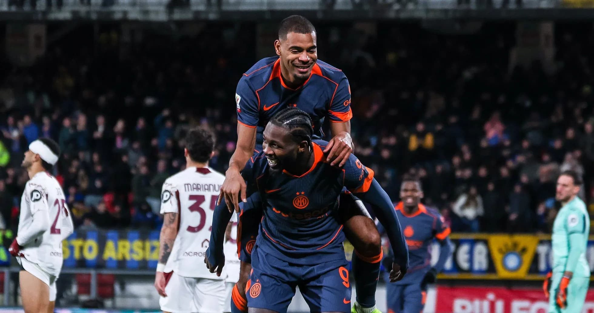 Players celebrating a goal during a match Players celebrating a goal during a match