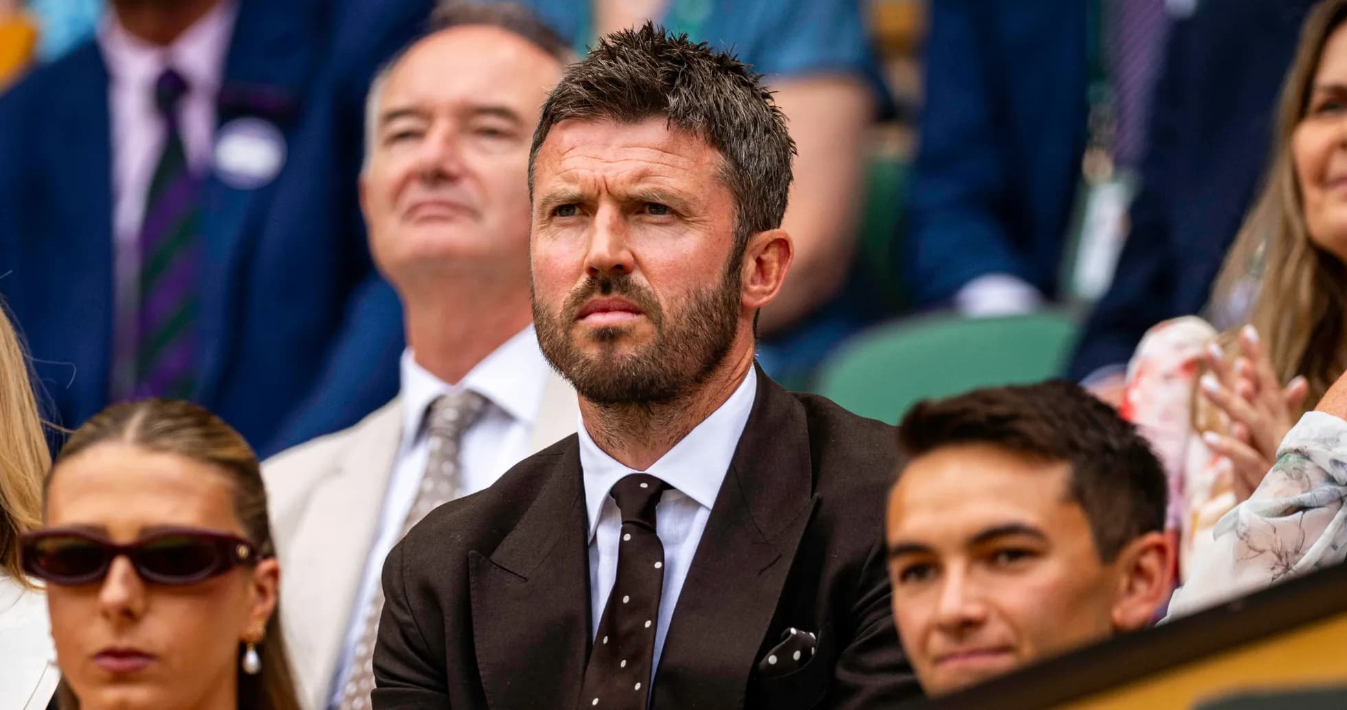 Man in suit watching tennis match at Wimbledon Man in suit watching tennis match at Wimbledon