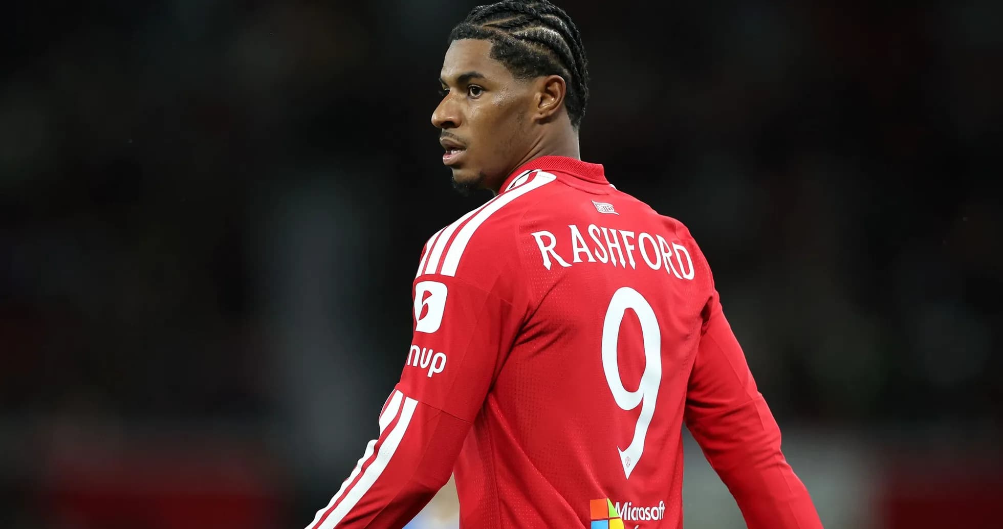 Player in red jersey with 'RASHFORD' and number 9 Player in red jersey with 'RASHFORD' and number 9