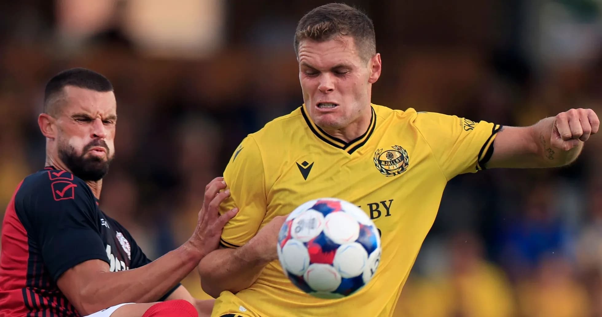 Mjallby player challenges Slovan Bratislava opponent Mjallby player challenges Slovan Bratislava opponent