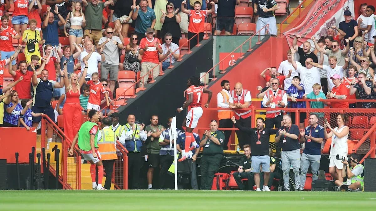 Fans celebrating a goal at the stadium Fans celebrating a goal at the stadium