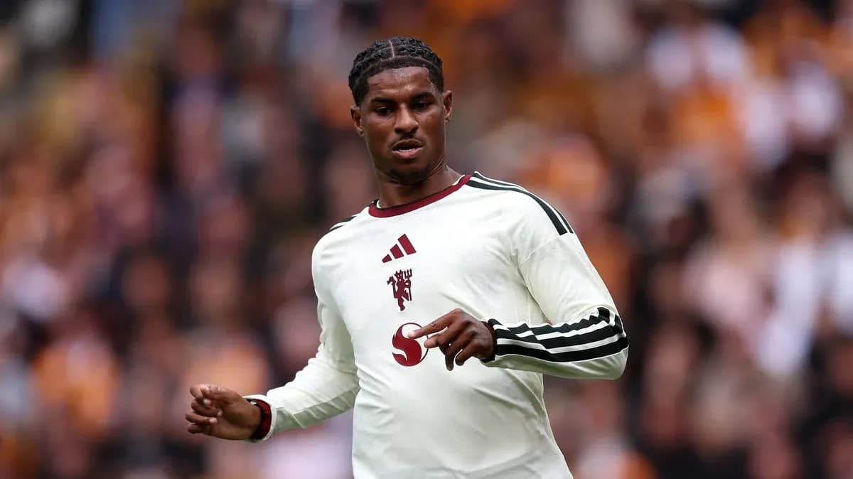 Player in white kit during a match Player in white kit during a match