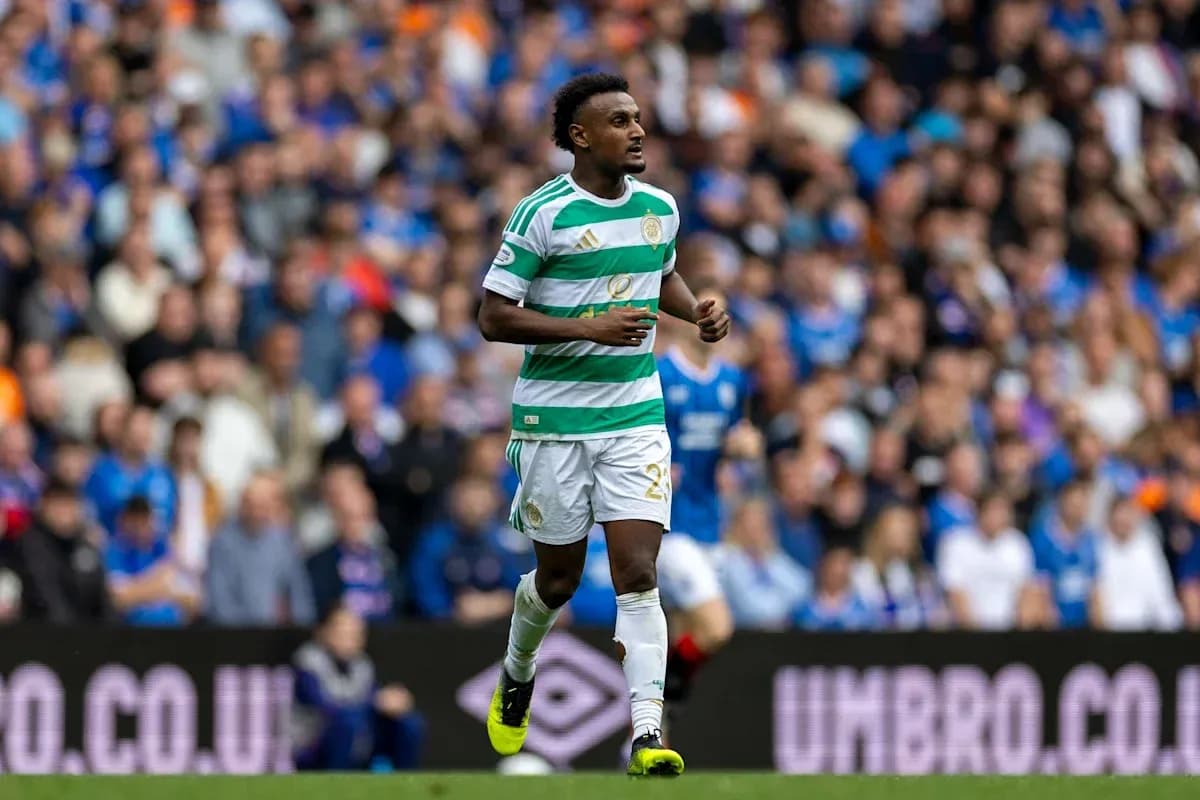 Celtic player running on pitch during match Celtic player running on pitch during match