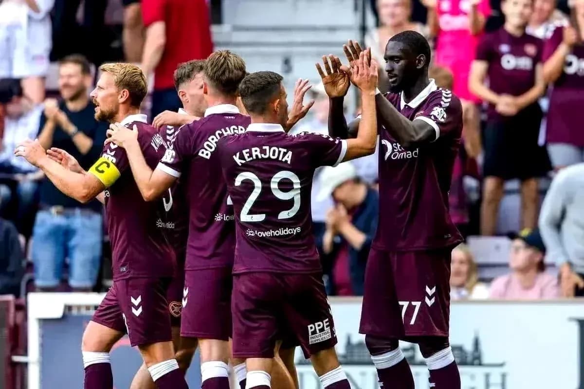 Hearts players celebrating a goal together Hearts players celebrating a goal together