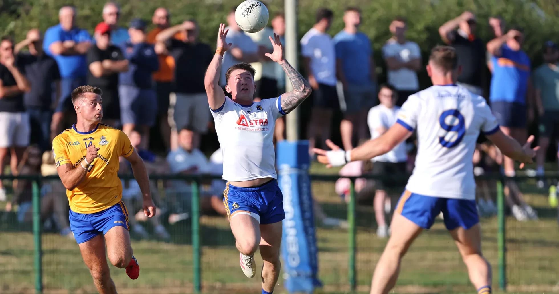 Player catching ball during a match with spectators Player catching ball during a match with spectators