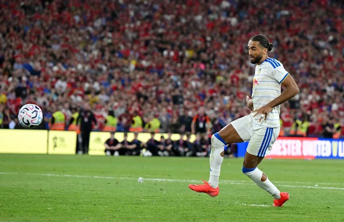 Player kicking the ball during a match Player kicking the ball during a match