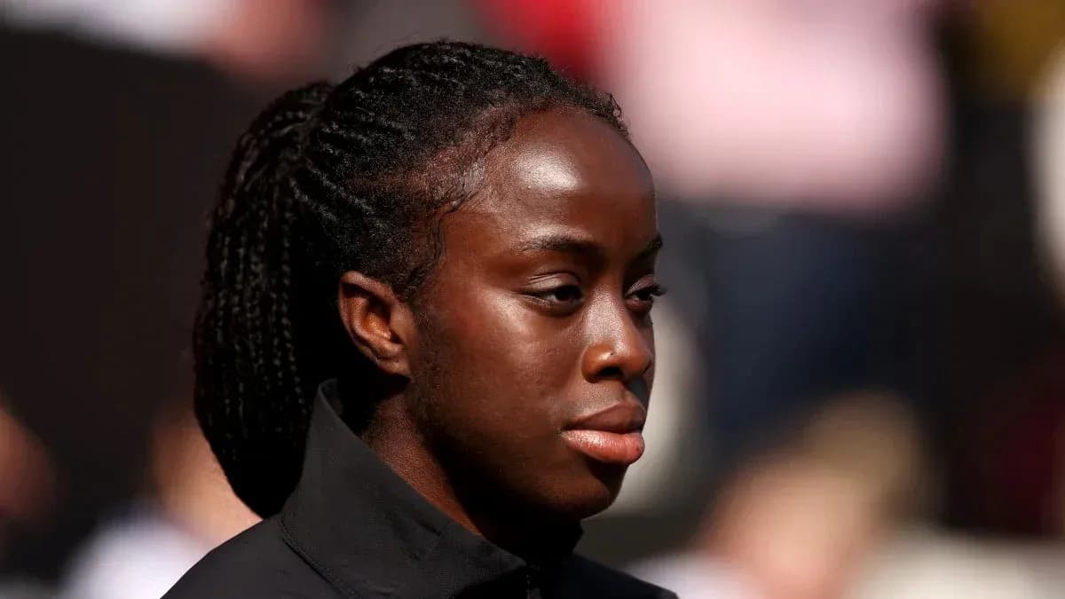 Athlete with braided hair during event preparation Athlete with braided hair during event preparation