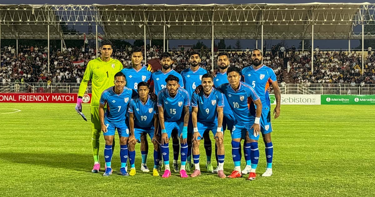 Football team posing for a group photo before match Football team posing for a group photo before match