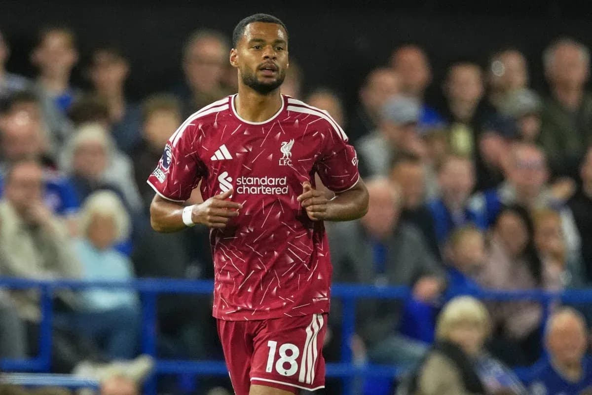 Liverpool player running during match in red kit Liverpool player running during match in red kit