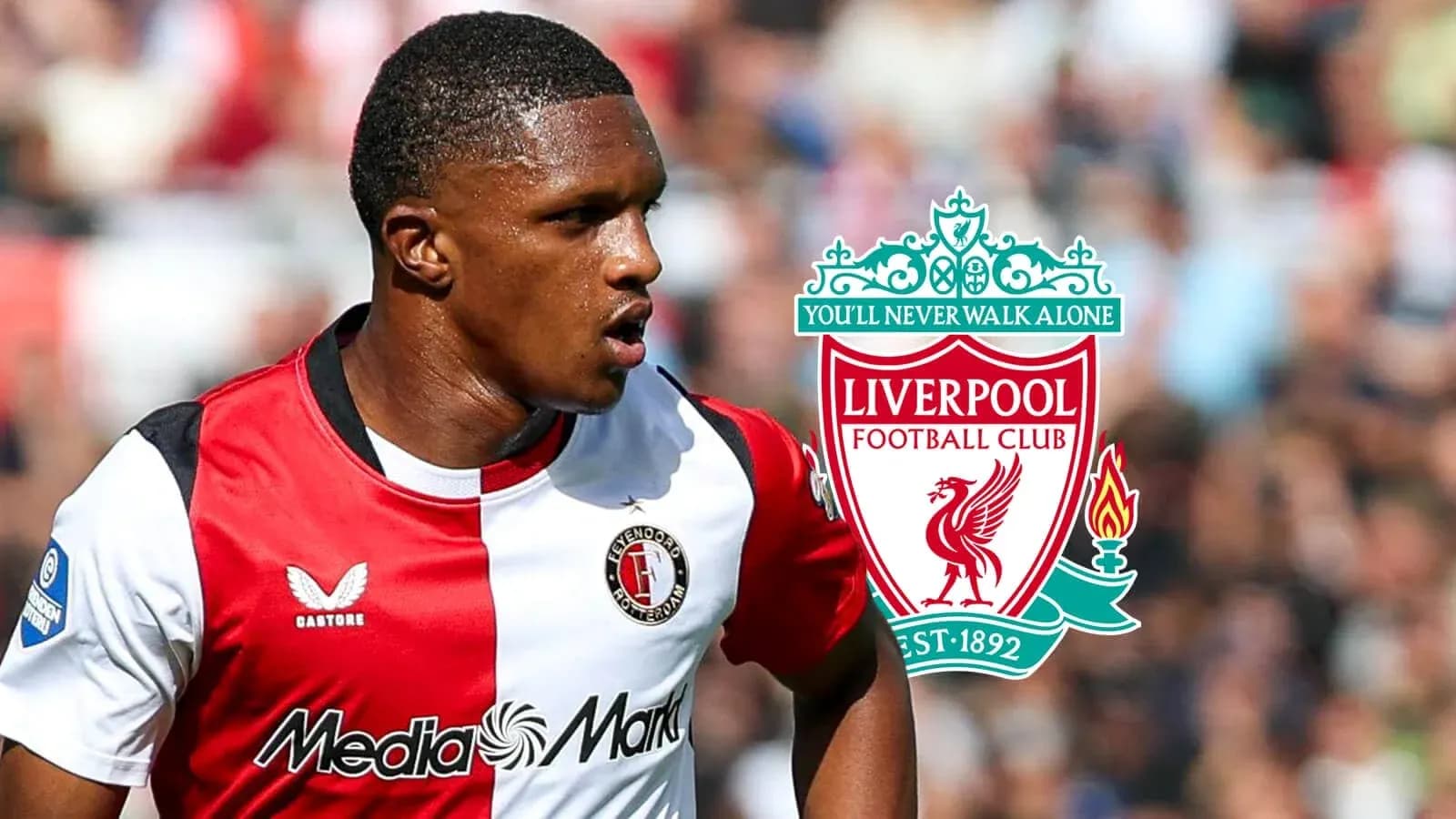 Feyenoord player with Liverpool logo in background Feyenoord player with Liverpool logo in background