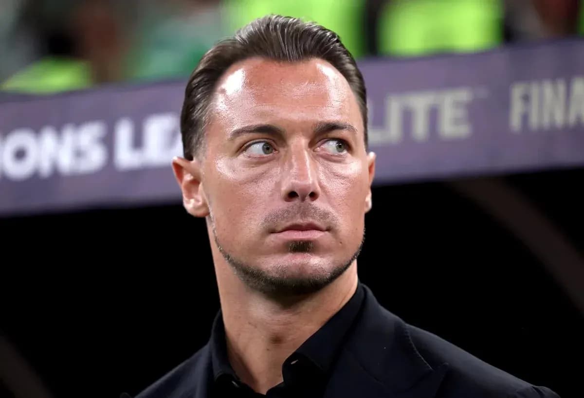 Coach looking focused during a match Coach looking focused during a match