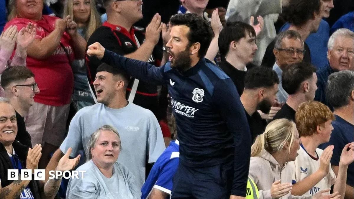 Player celebrating with fans during a match Player celebrating with fans during a match