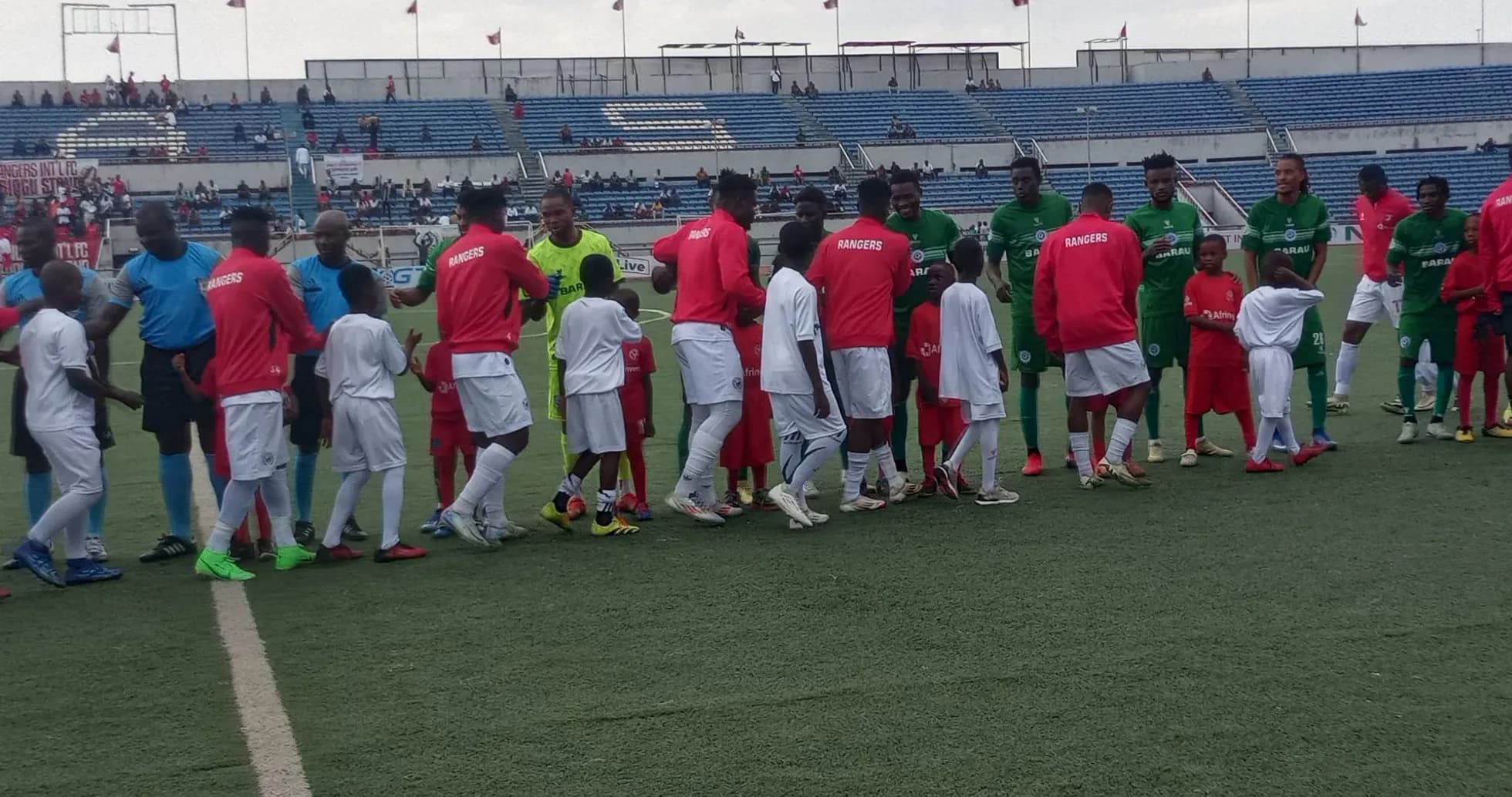 Players from Barau FC and Enugu Rangers shaking hands Players from Barau FC and Enugu Rangers shaking hands