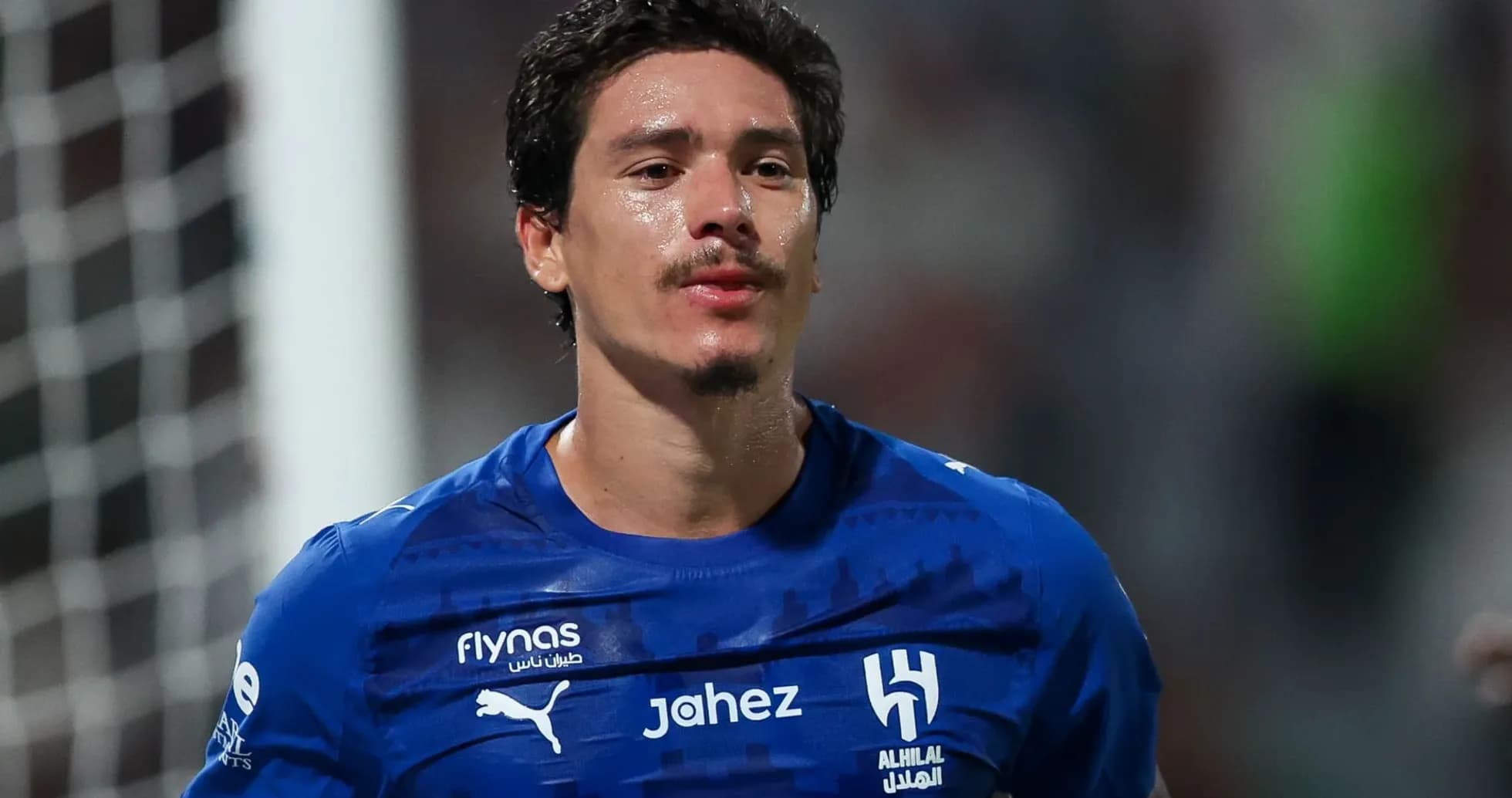 Player wearing blue jersey celebrating on the field Player wearing blue jersey celebrating on the field