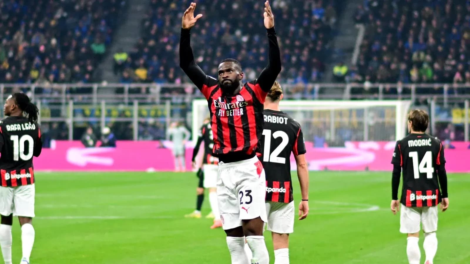 Player celebrating during a match with teammates Player celebrating during a match with teammates