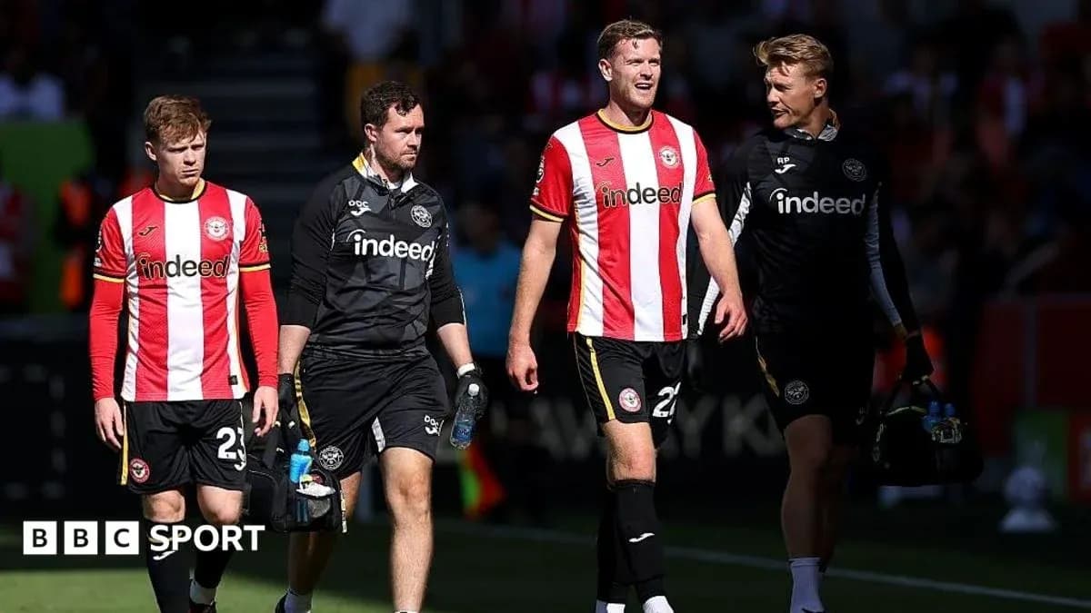 Brentford players walking off the pitch together Brentford players walking off the pitch together