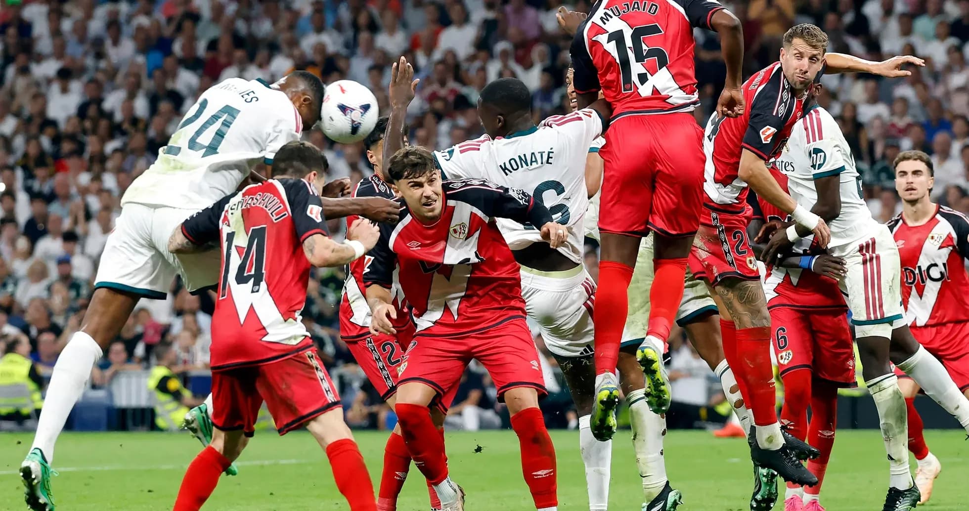 Players contesting a corner kick during match Players contesting a corner kick during match